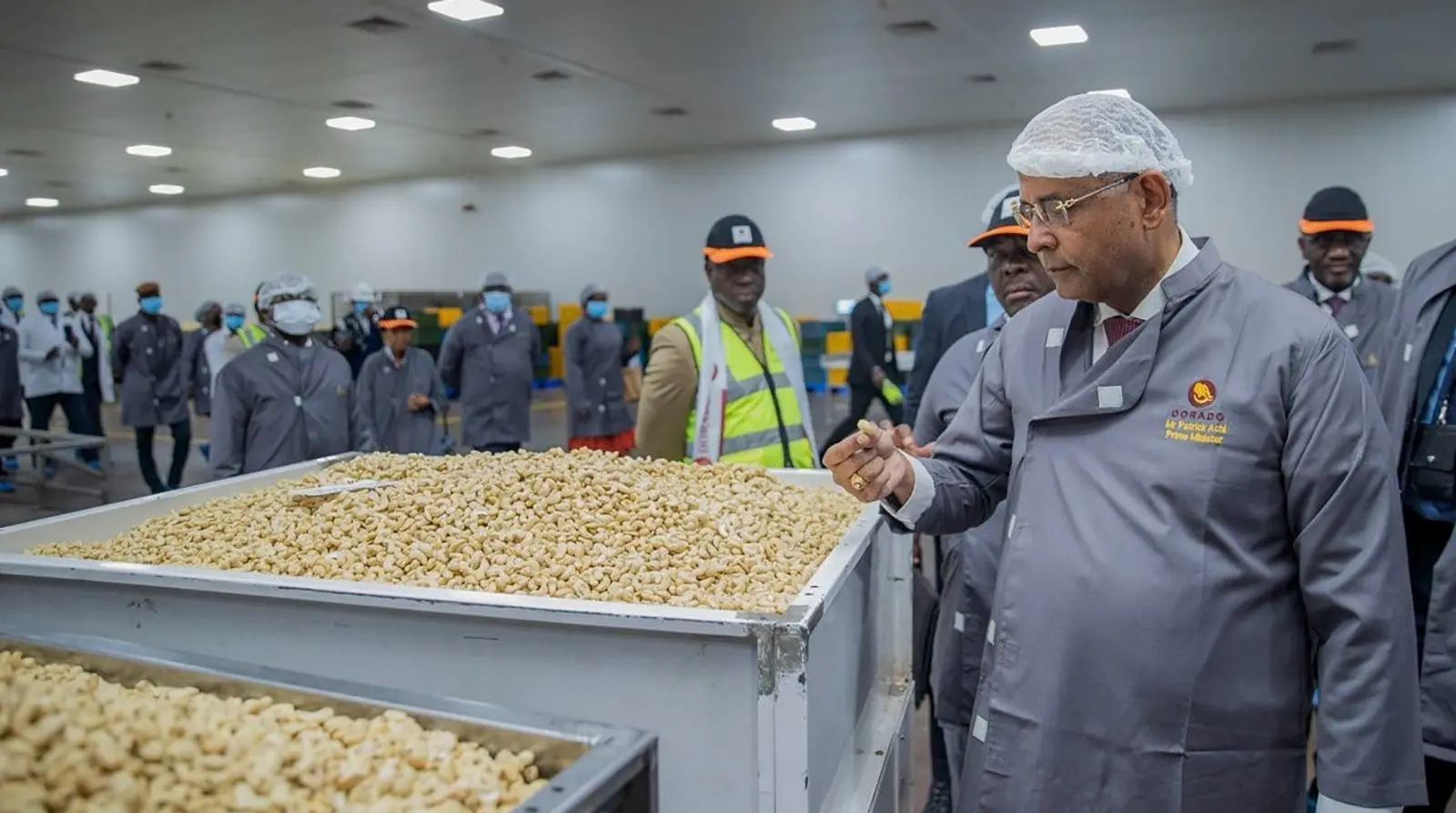 Picking cashew nuts from a bowl