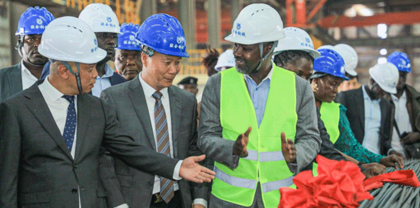  Deputy Speaker of Parliament Thomas Tayebwa (center) inspects a production line at Unisteel in Mbale District recently.
