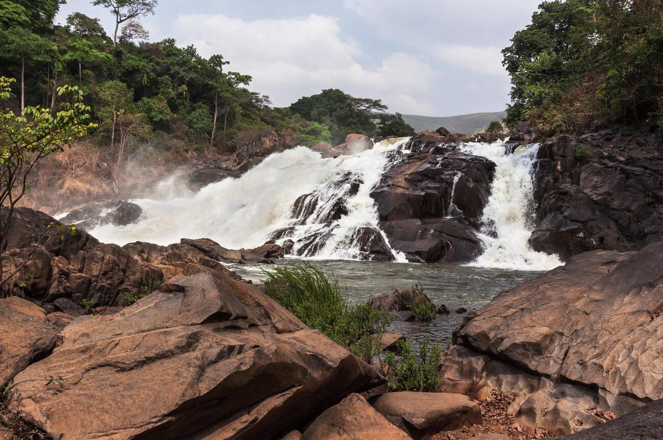 Bumbuna Falls on rapids of River Rokel in bush amongst lush vegetation of rain forest near Bumbuna village, Sierra Leone Bumbuna Falls on rapids of River Rokel in bush amongst lush vegetation of rain forest near Bumbuna village, Sierra Leone