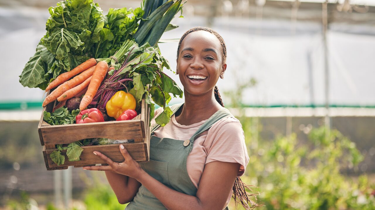 vegetables a woman is holding different vegetables