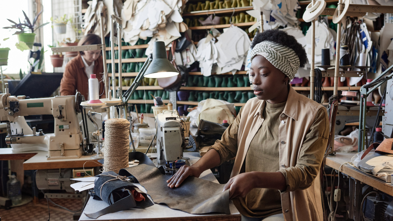 a woman is working in garments industry