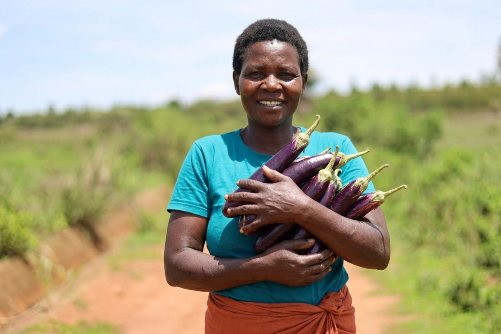 a-woman-is-holding-brinjal.